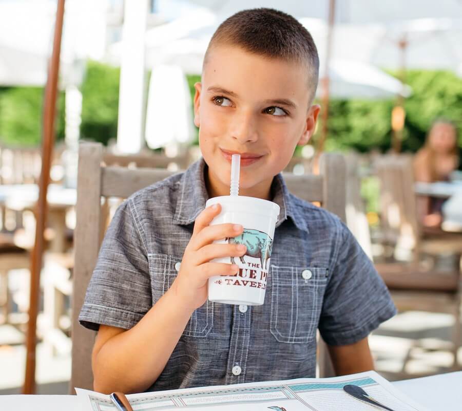 boy drinking from a sippy cup